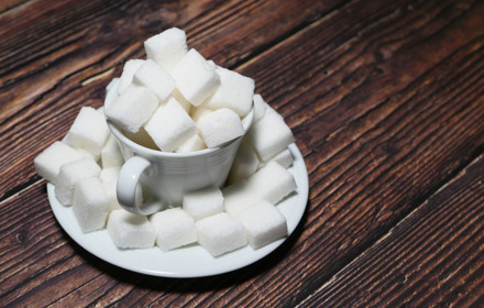 Sugar Cubes In A Tea Cup On Wooden Table