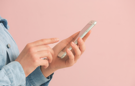 A Person Using Their Mobile Phone R