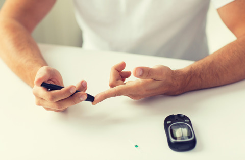 Man Checking Blood Sugar Levels