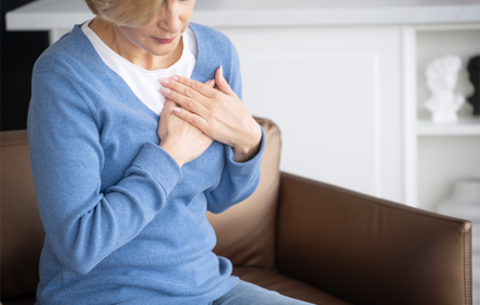 Woman With Chest Heart Pain R
